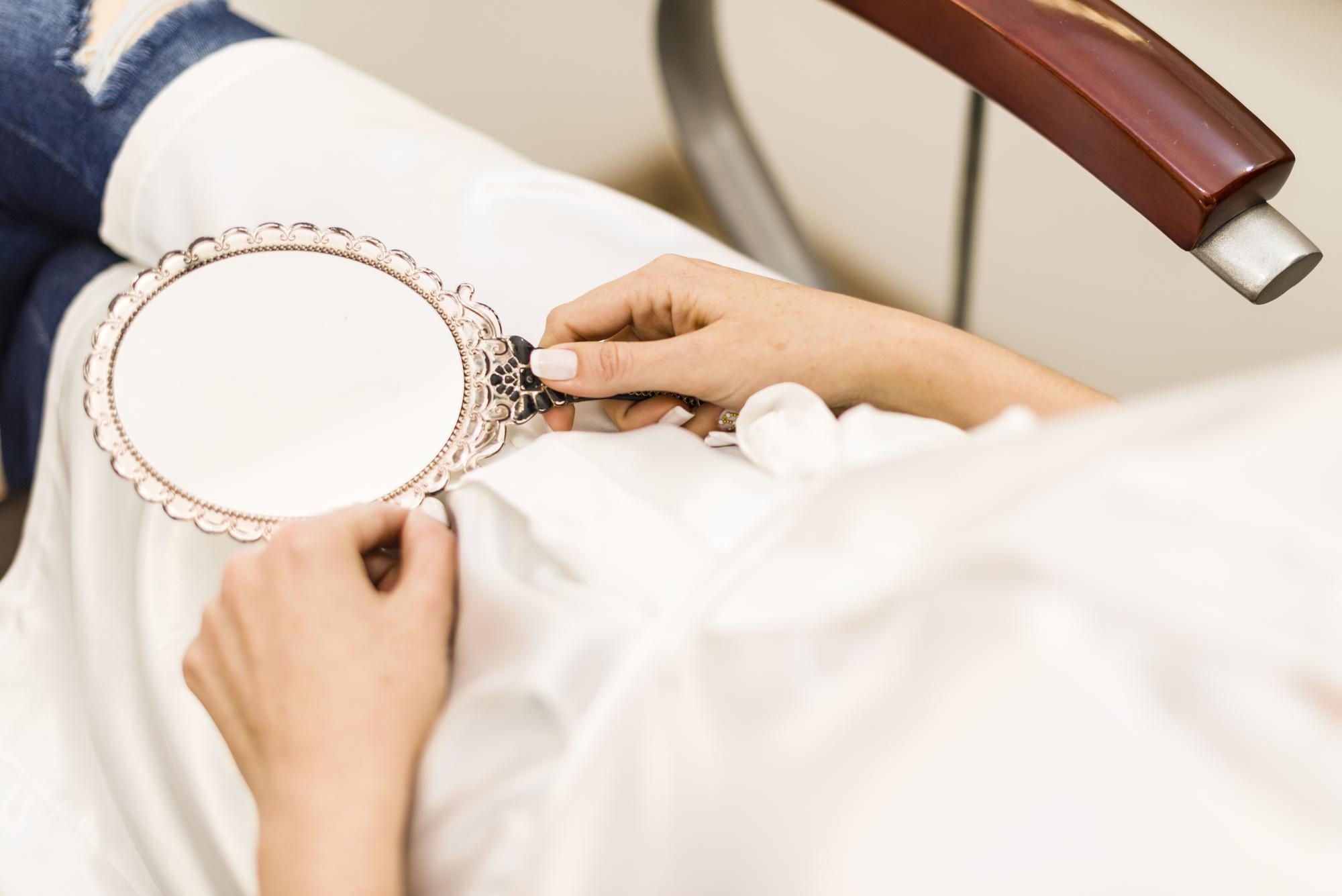 Artisan hands embroidering silk
